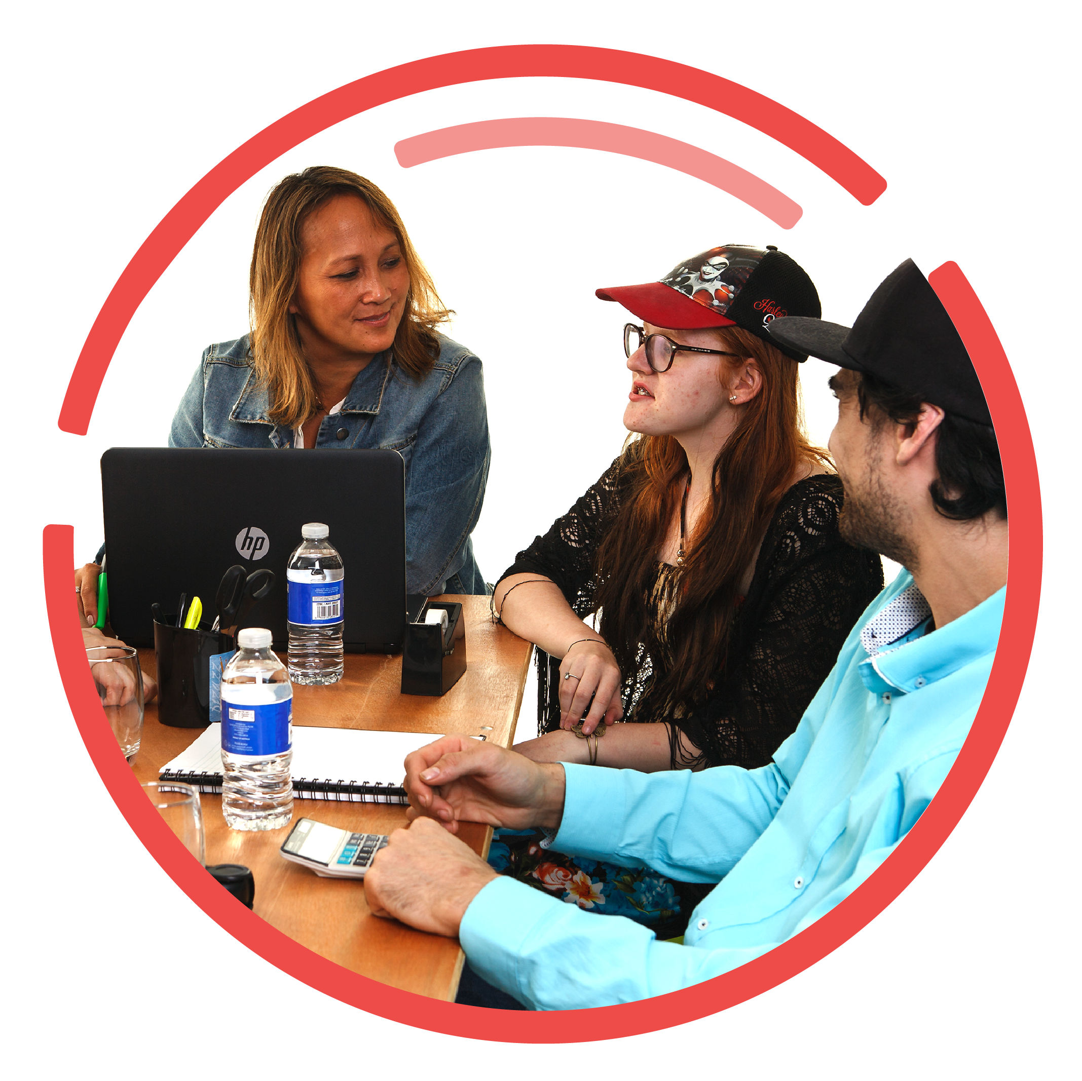 A group of people sitting at a table having a discussion.