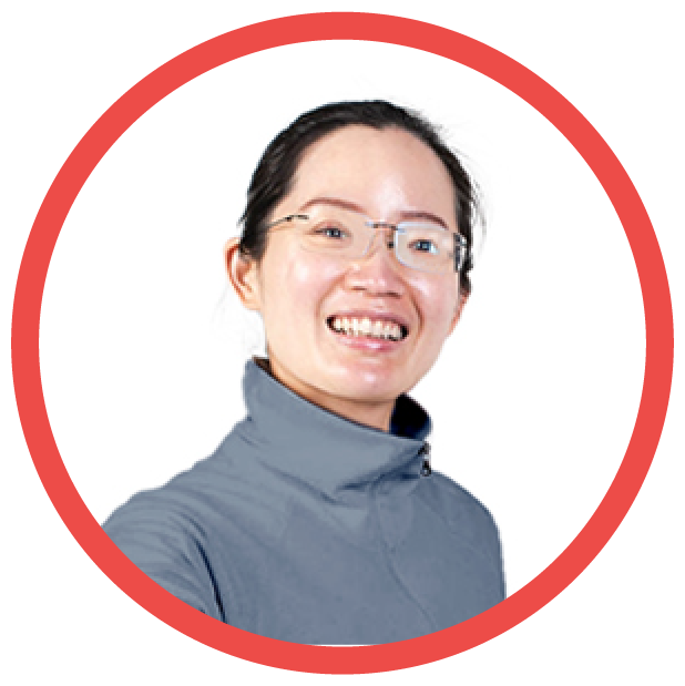 A person with glasses smiling.