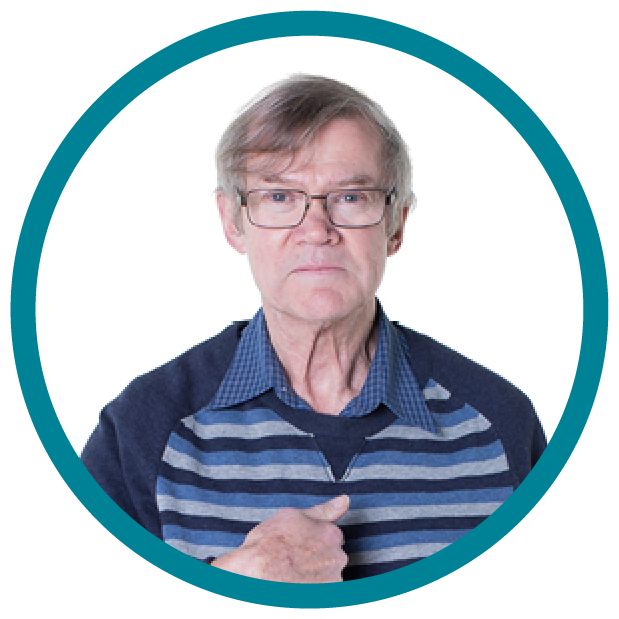 An older person pointing at themselves.