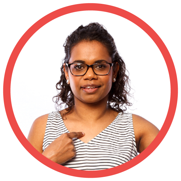 A First Nations person pointing at themselves and smiling.